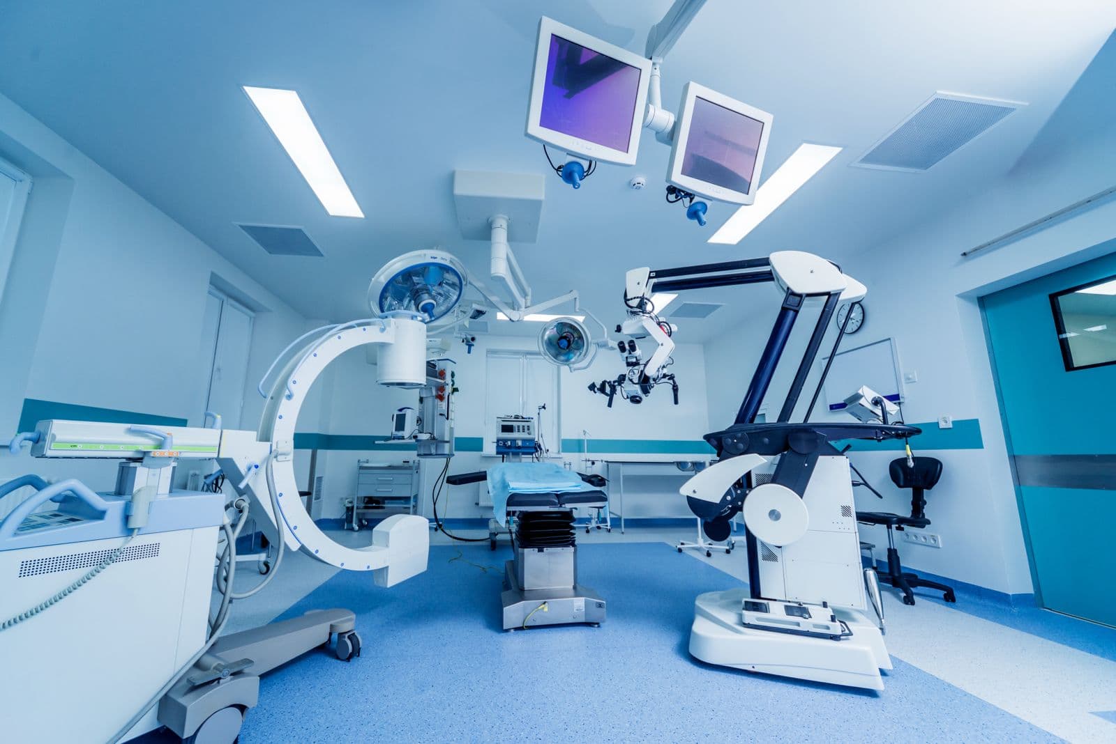 Modern operating room with surgical robotics and imaging systems